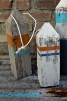 ocean wooden buoys orange, turquoise, blue