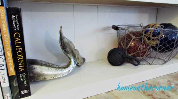 family room shelves coastal, whale tail, glass floats