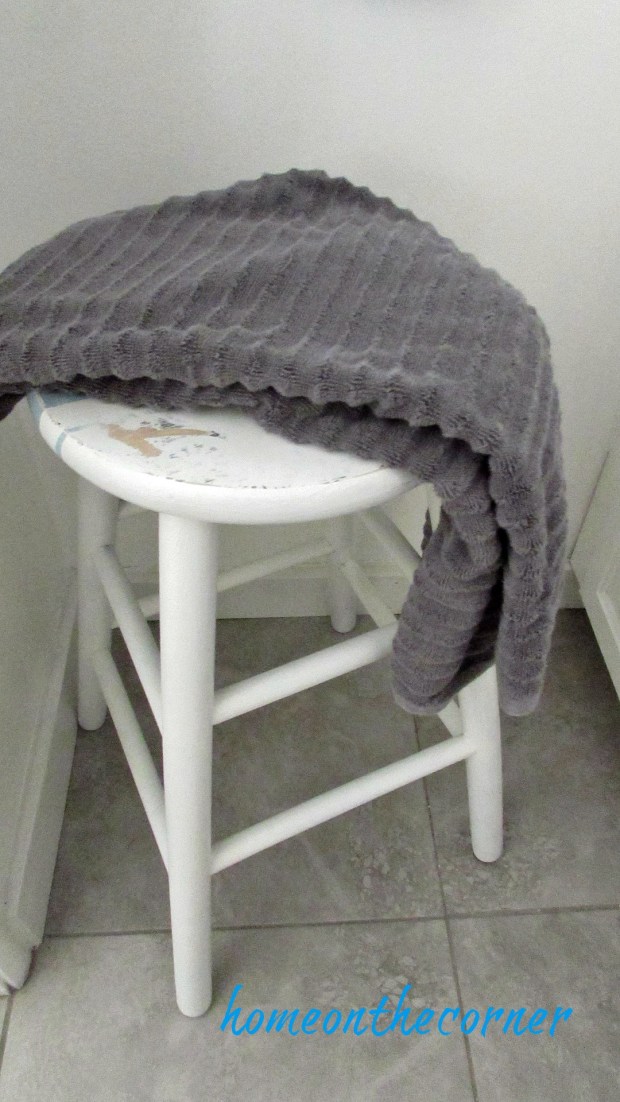 master bathroom makeover stool and grey towel