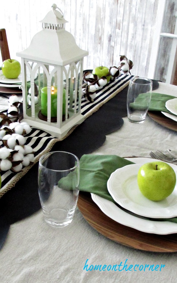 green and black dining room with apples