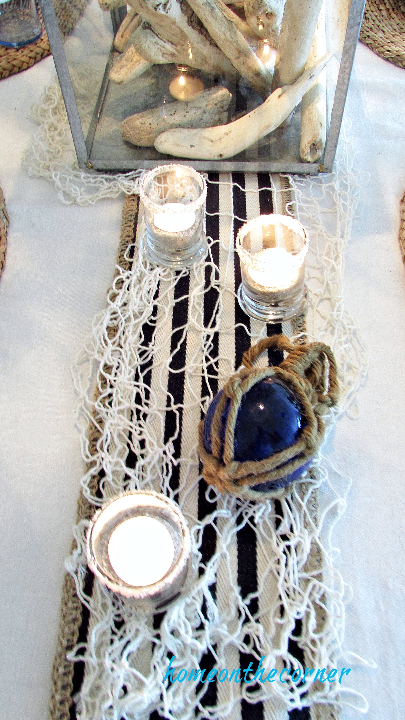 blue and white dining room fisherman net and candles