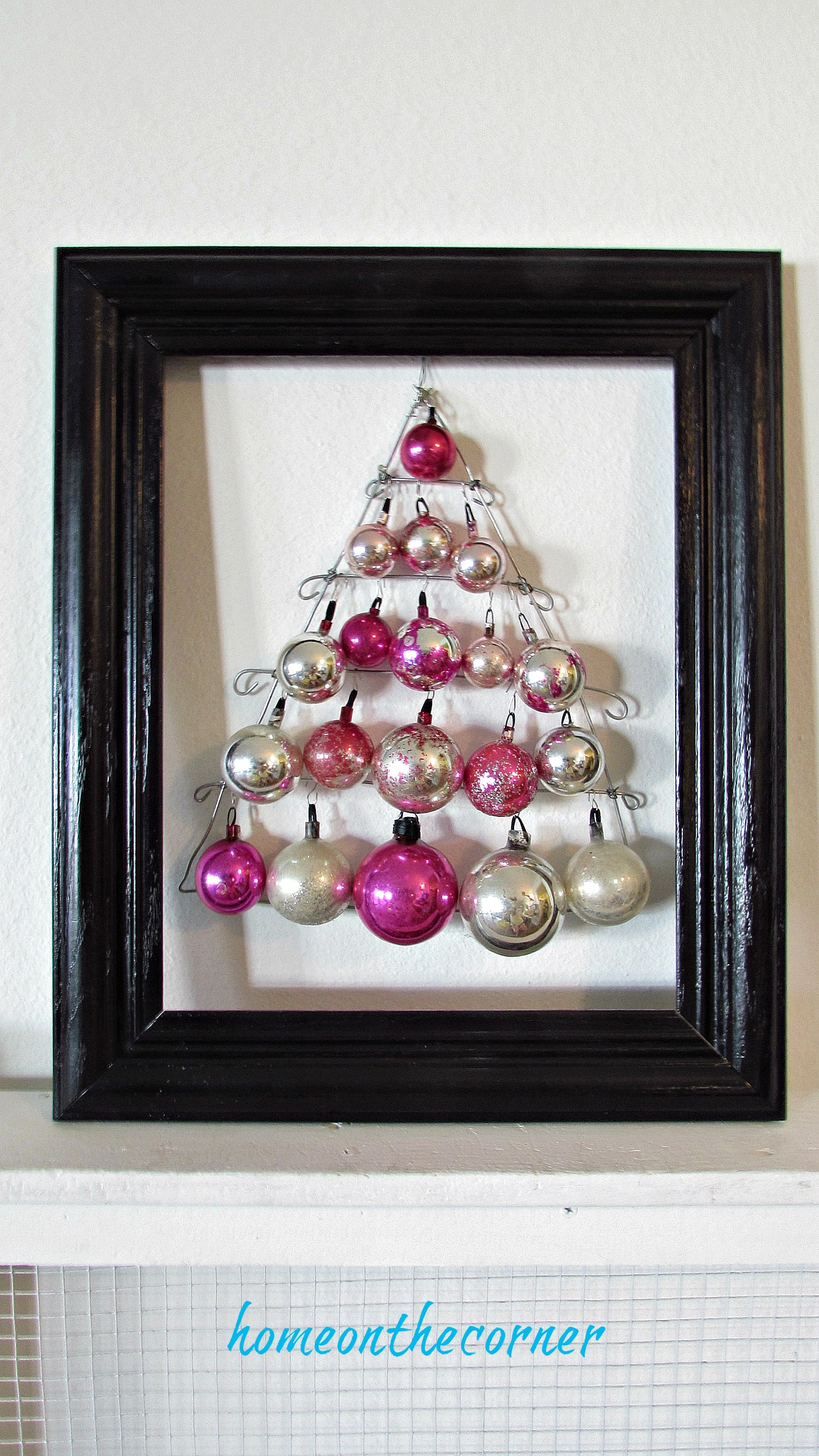 pink christmas ornament tree with black frame