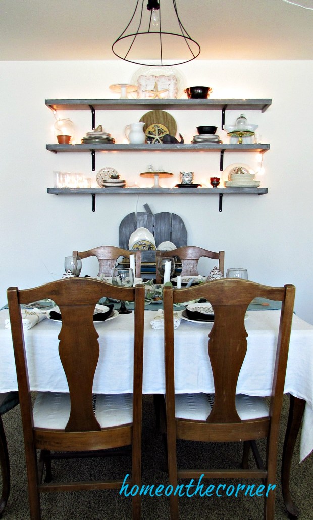 ear.y fall dining room table and lighted shelves