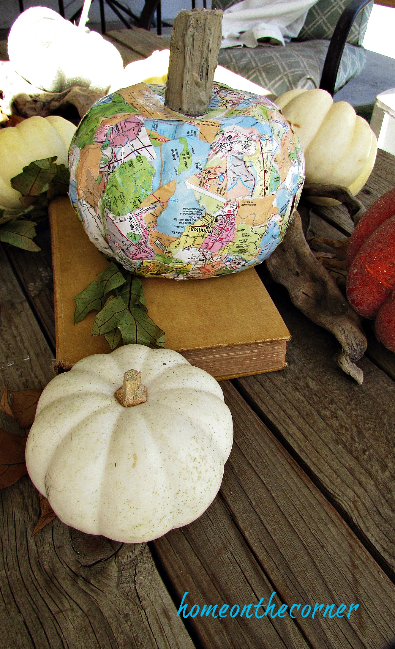 travel map pumpkin with small white pumpkins