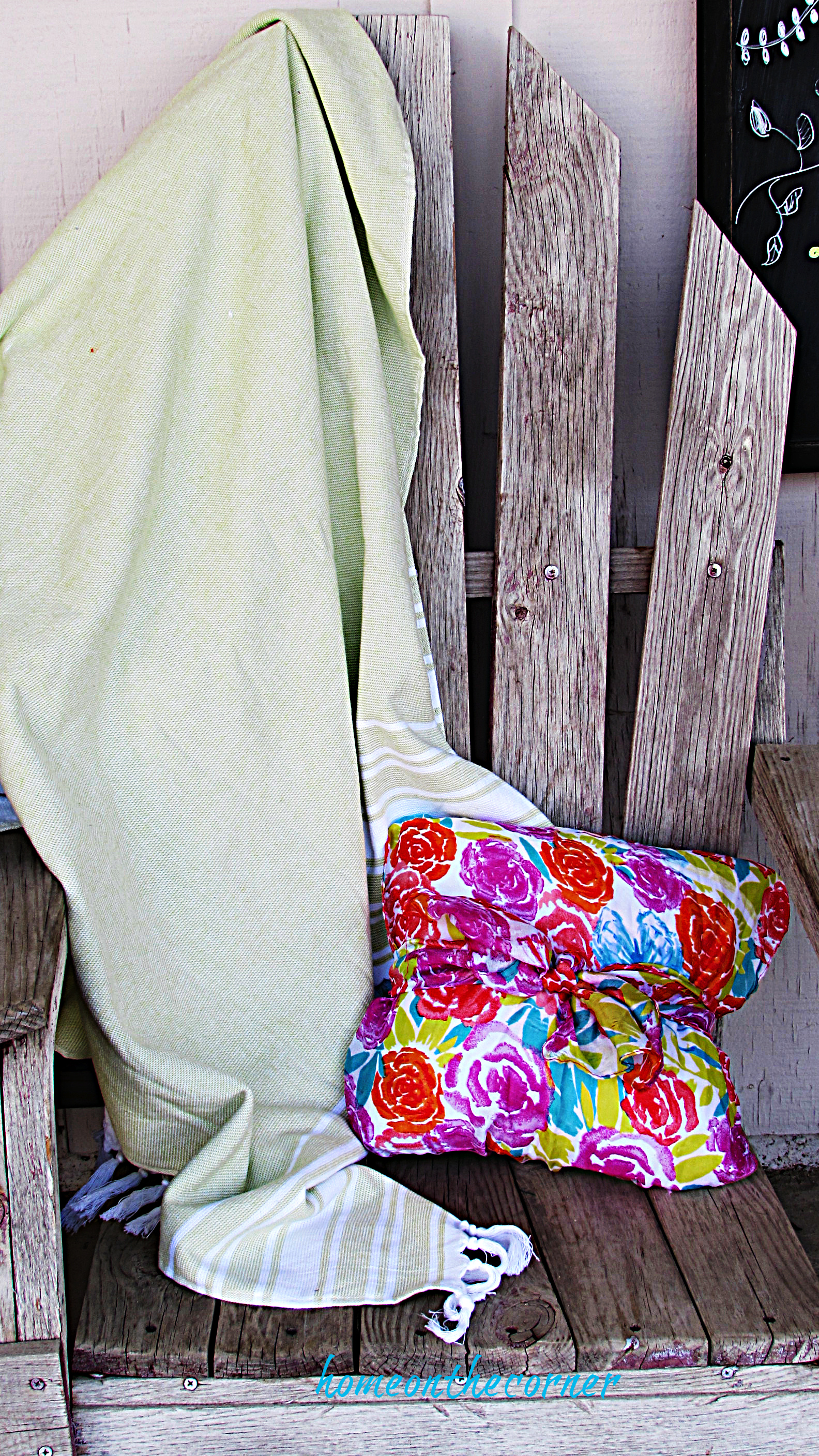 spring porch green blanket and floral pillow