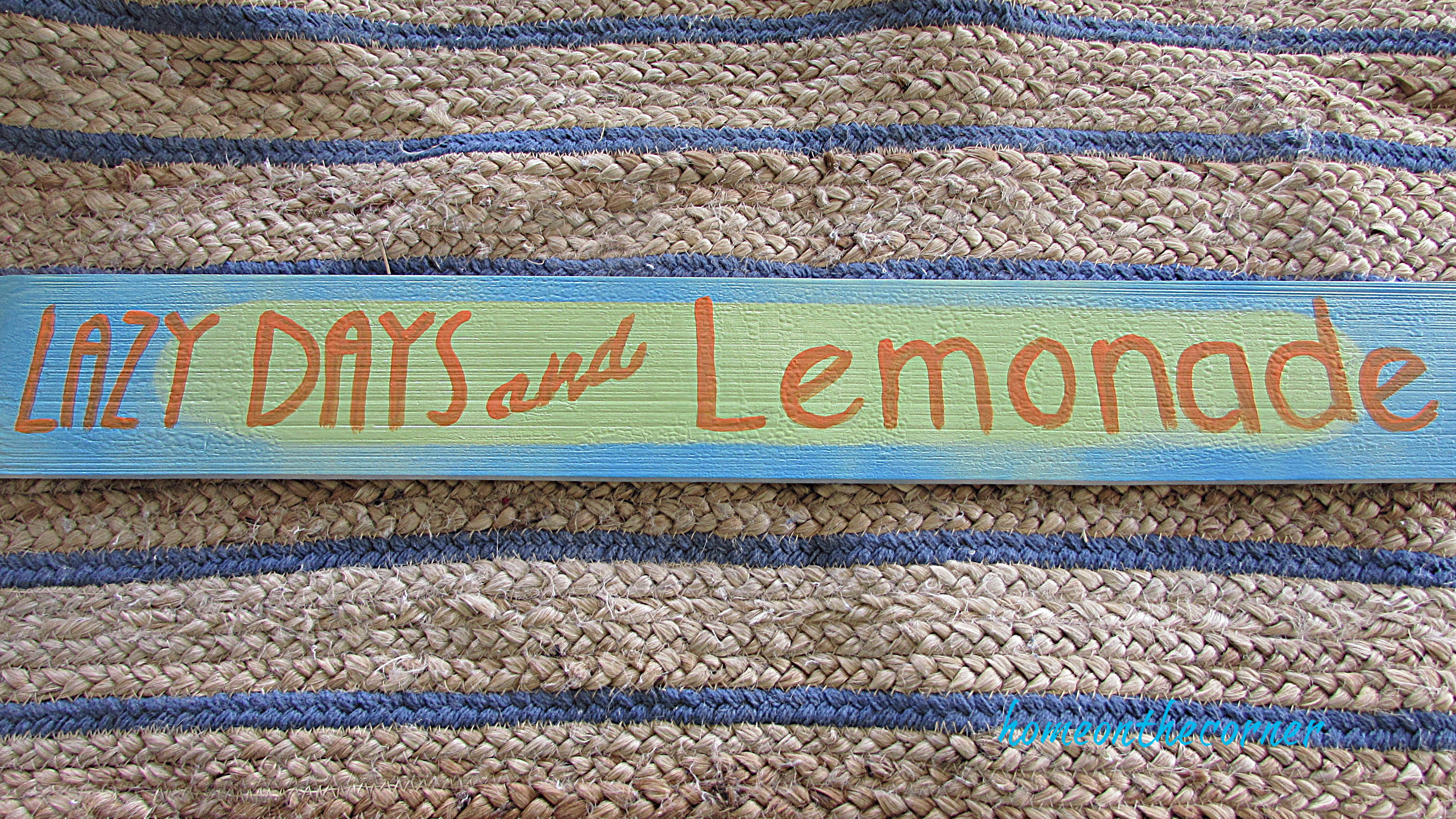 lazy days wood sign with orange writing