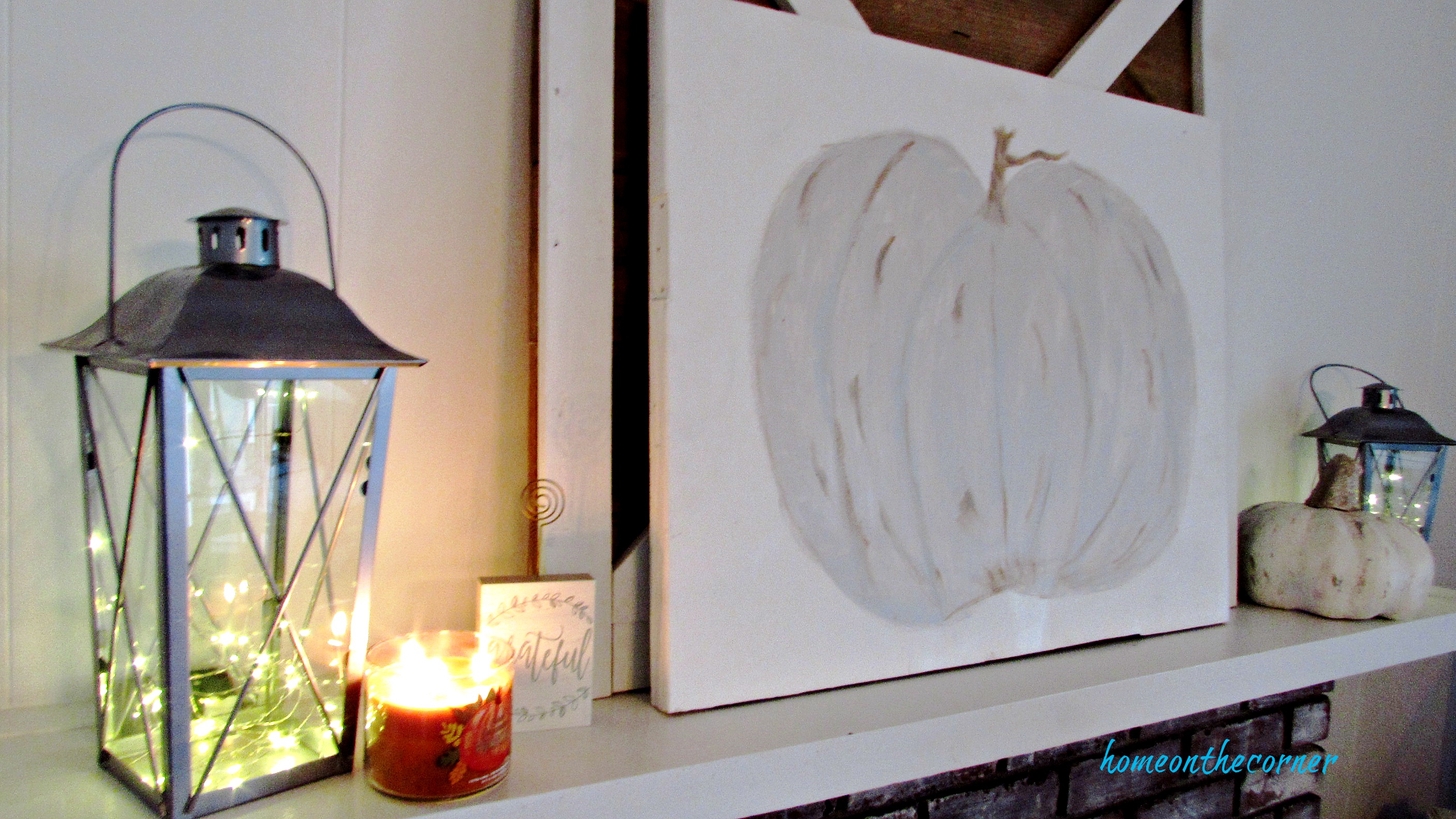 cream pumpkin fall mantle lanterns and candles