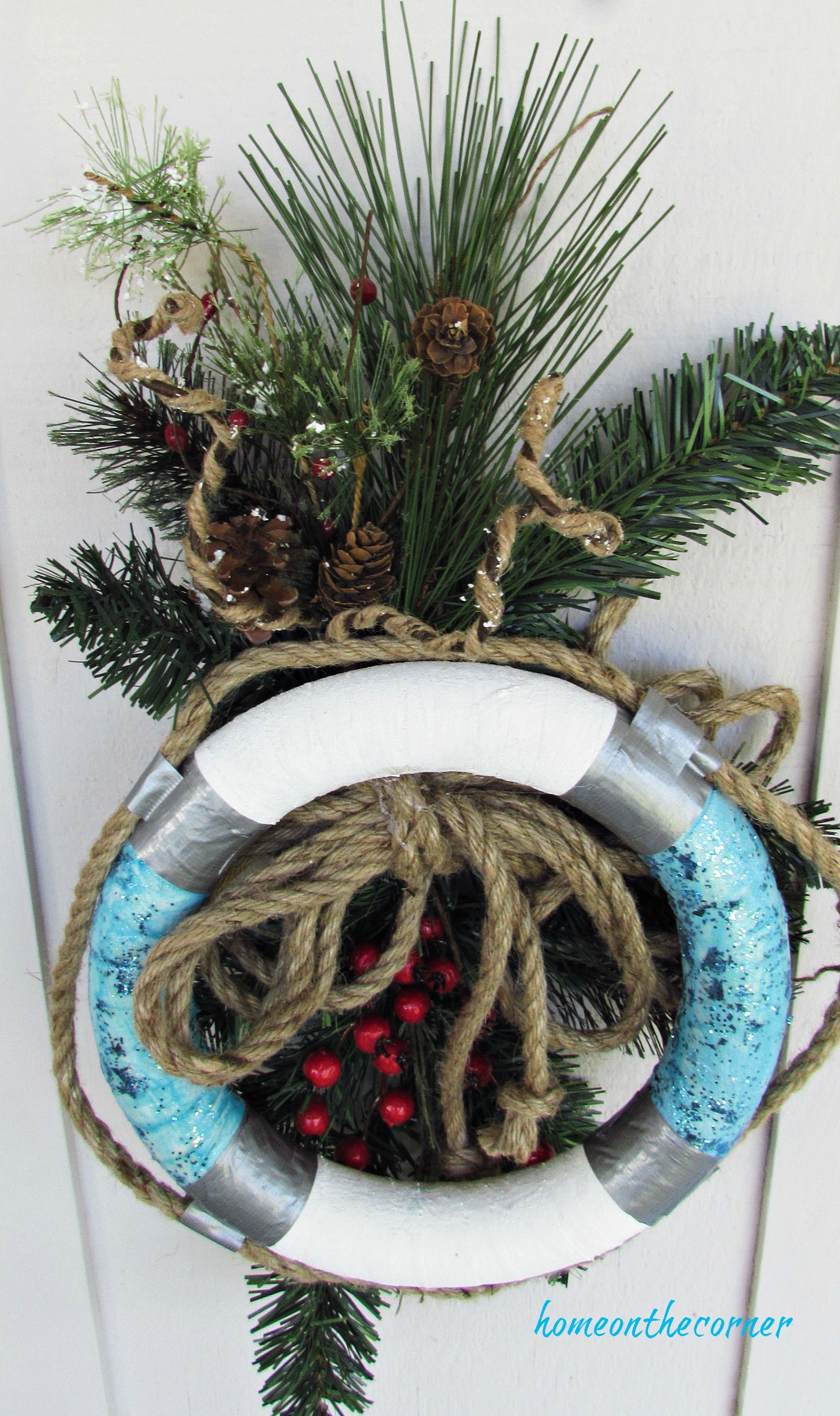 christmas wreath buoy rope and pinecones