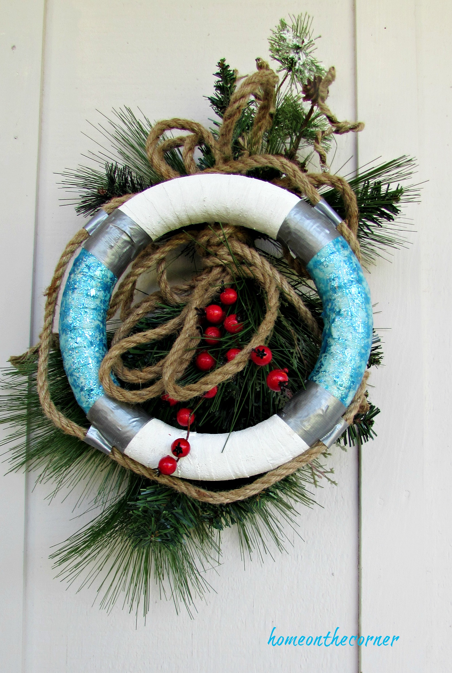 christmas wreath life buoy rope, greens, rope and berries