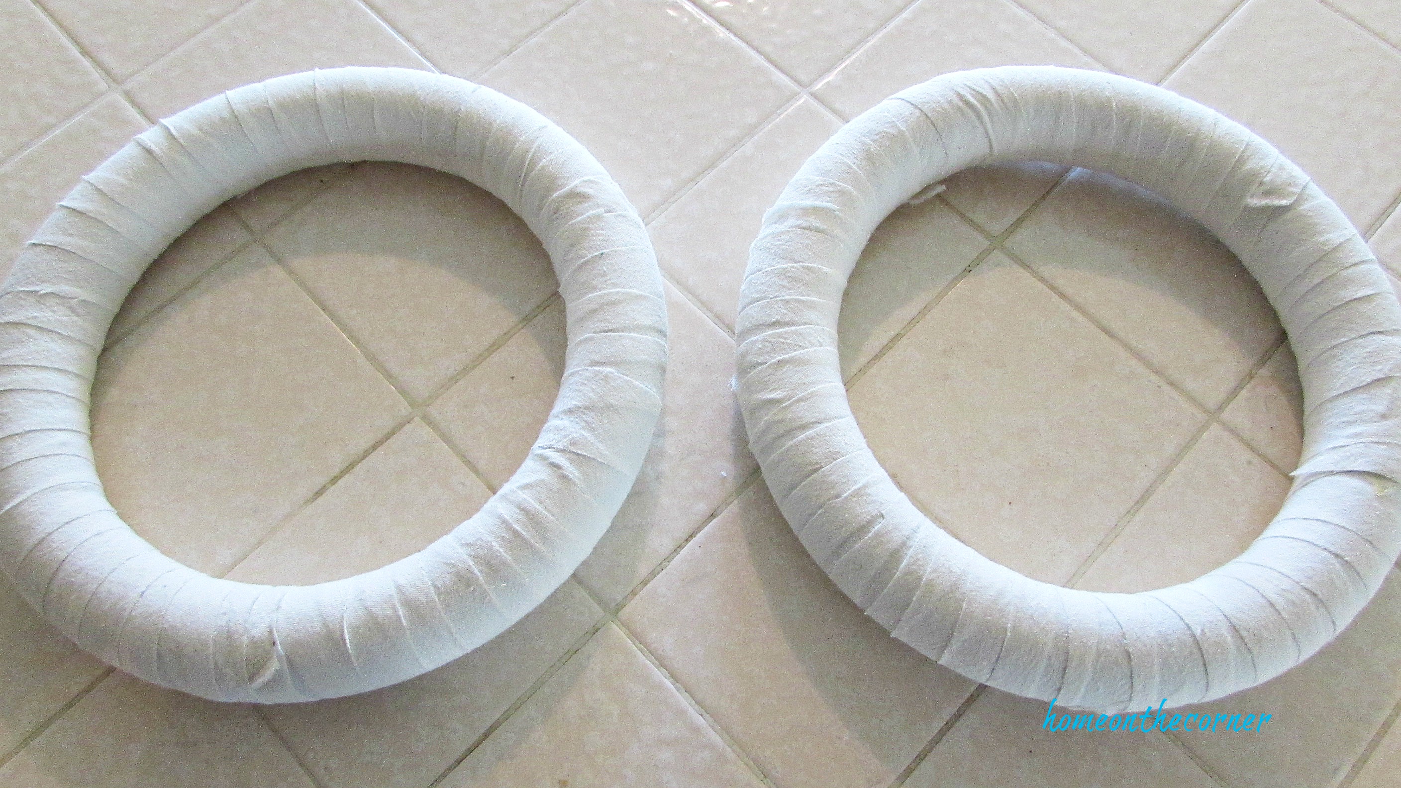 christmas wreath wrapped with muslin strips